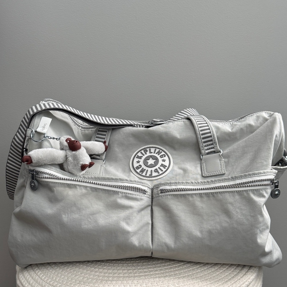 Kipling Light Gray Duffel Bag with Striped Strap